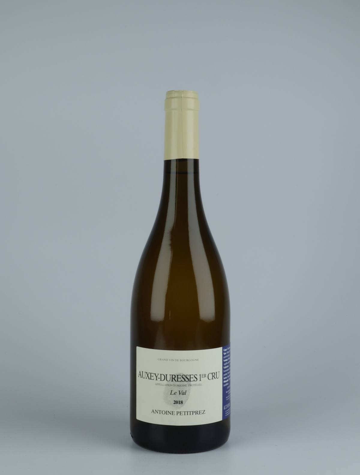 A bottle 2018 Auxey Duresses 1. Cru - Le Val White wine from Antoine Petitprez, Burgundy in France