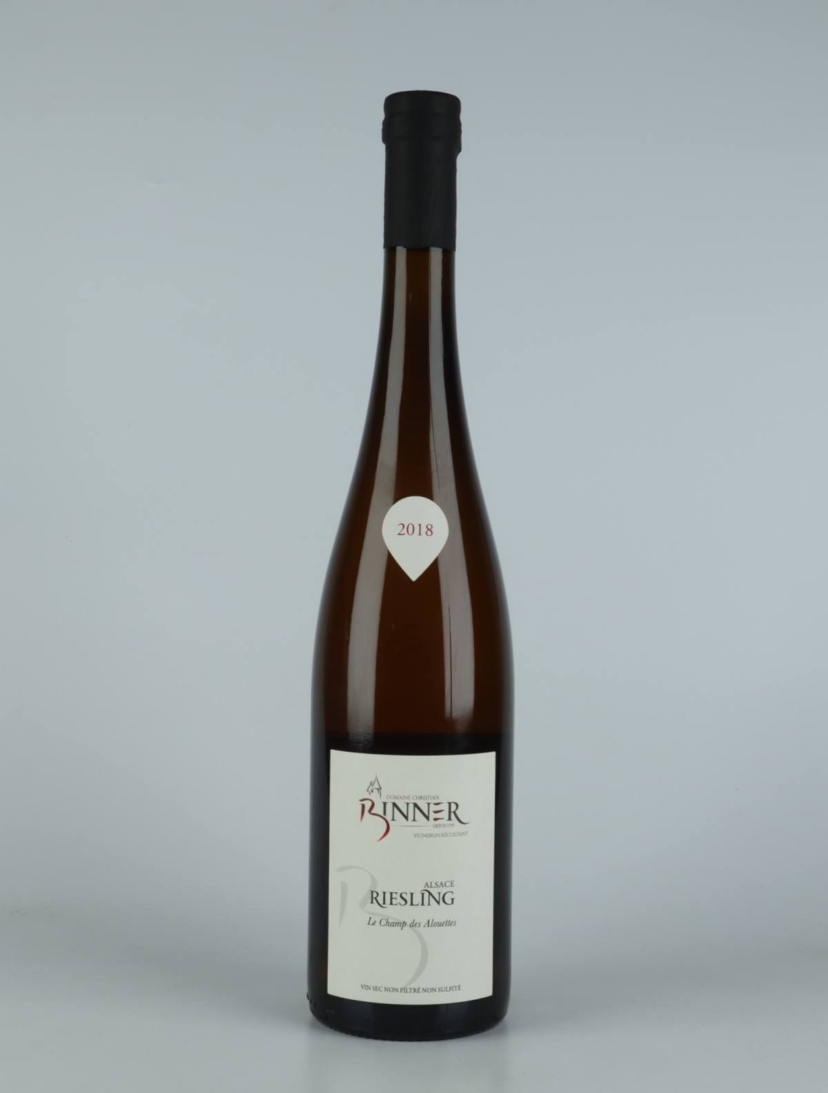 A bottle  Riesling - Champs des Alouettes White wine from Domaine Christian Binner, Alsace in France