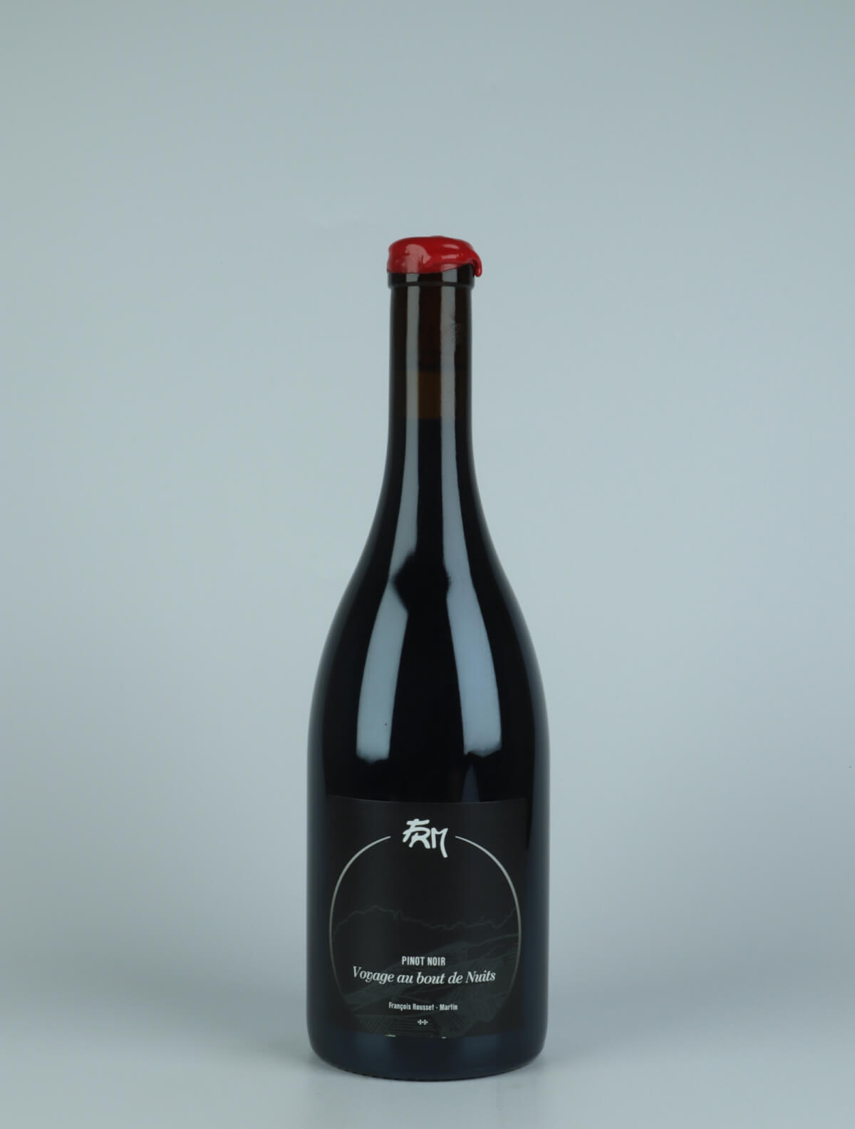 A bottle 2018 Voyage au Bout Nuits - Pinot Noir Red wine from François Rousset-Martin, Jura in France
