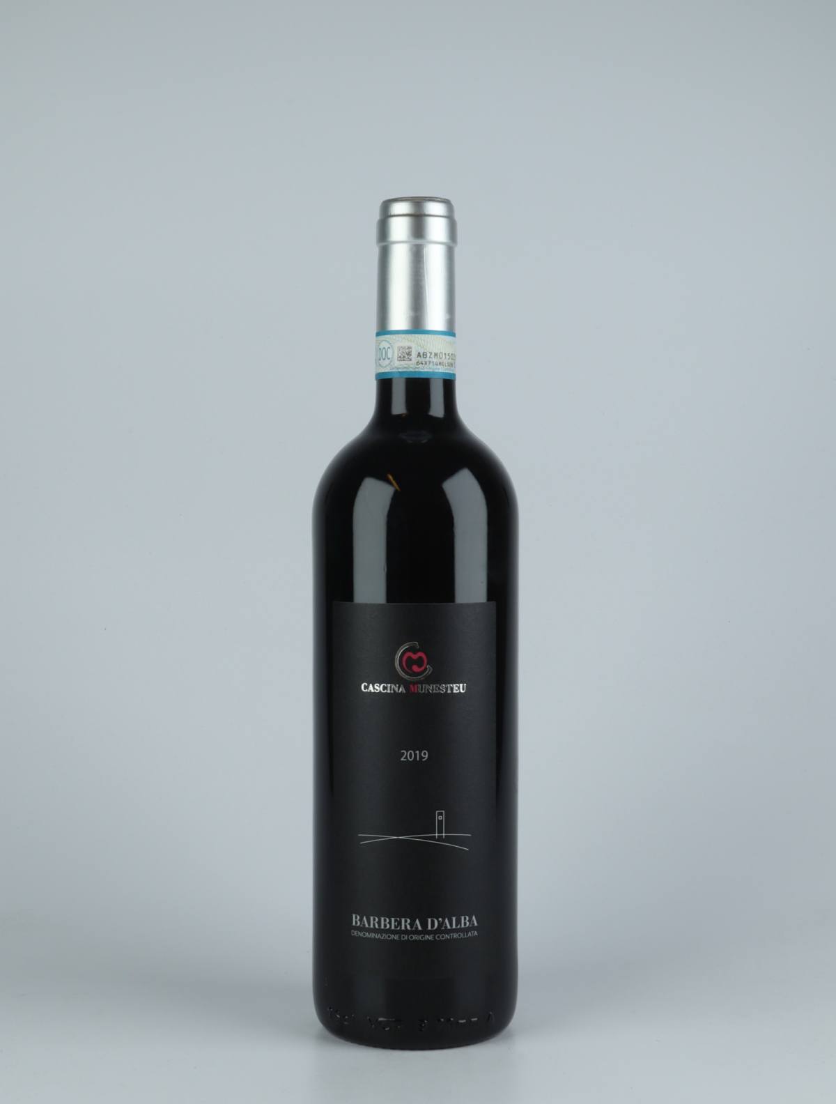 A bottle 2019 Barbera d'Alba Red wine from Cascina Munesteu, Piedmont in Italy