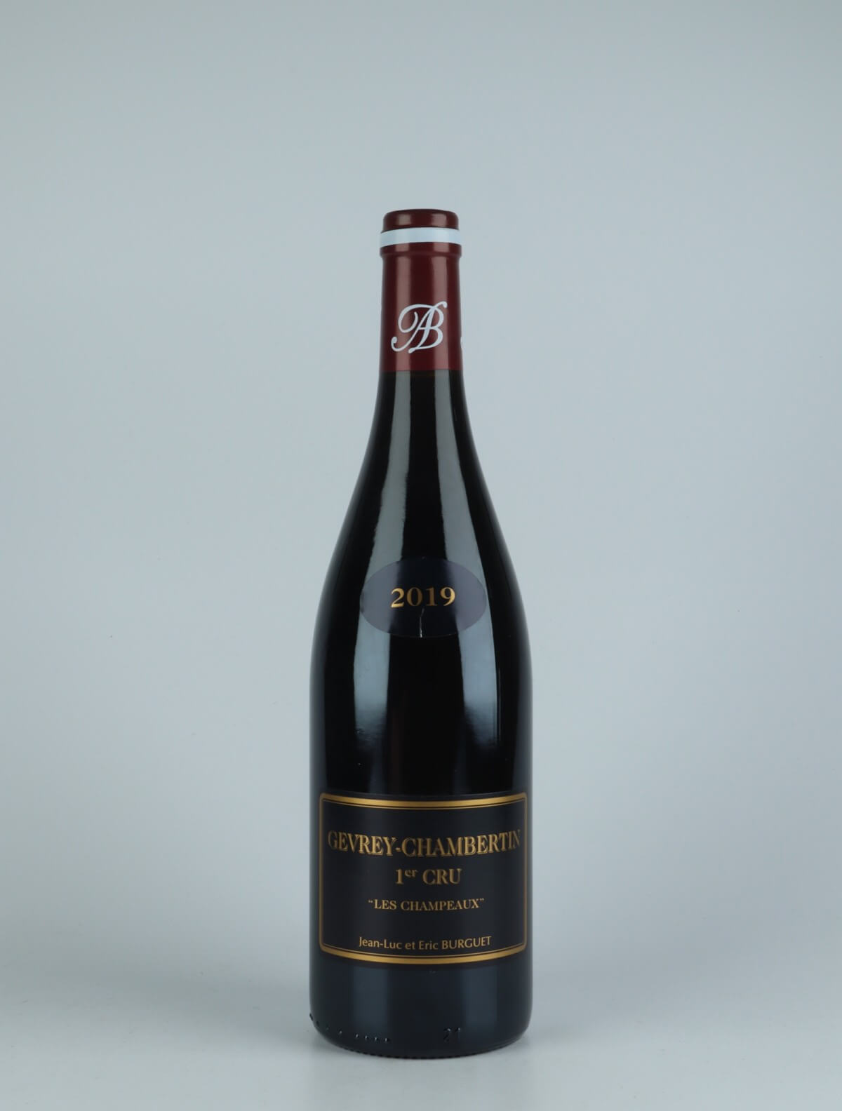 A bottle 2019 Gevrey-Chambertin 1. Cru Champeaux Red wine from Jean-Luc & Eric Burguet, Burgundy in France