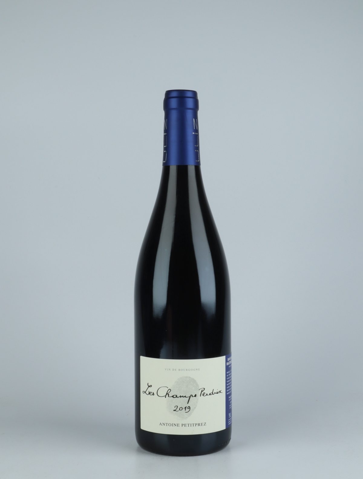 A bottle 2019 Hautes Côtes de Nuits - Les Champs Perdrix Red wine from Antoine Petitprez, Burgundy in France