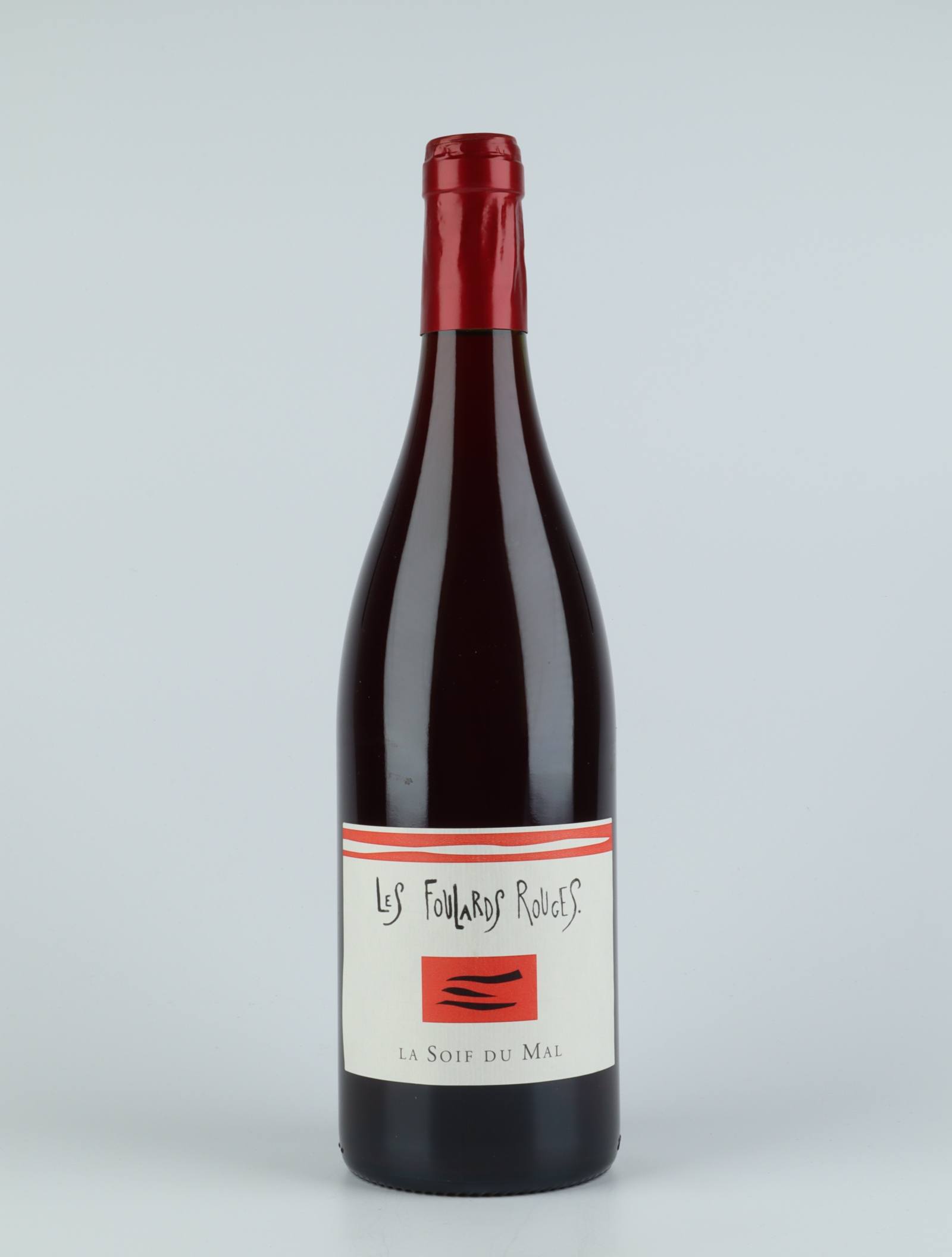 A bottle 2019 Soif du Mal Rouge Red wine from Les Foulards Rouges, Languedoc in France