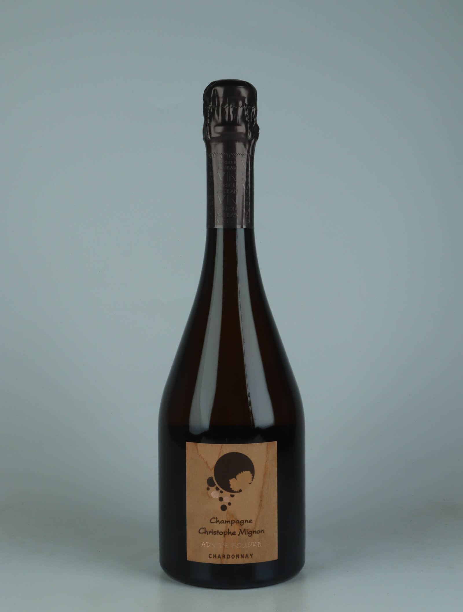 A bottle 2020 ADN de Foudre Chardonnay Brut Nature Sparkling from Christophe Mignon, Champagne in France