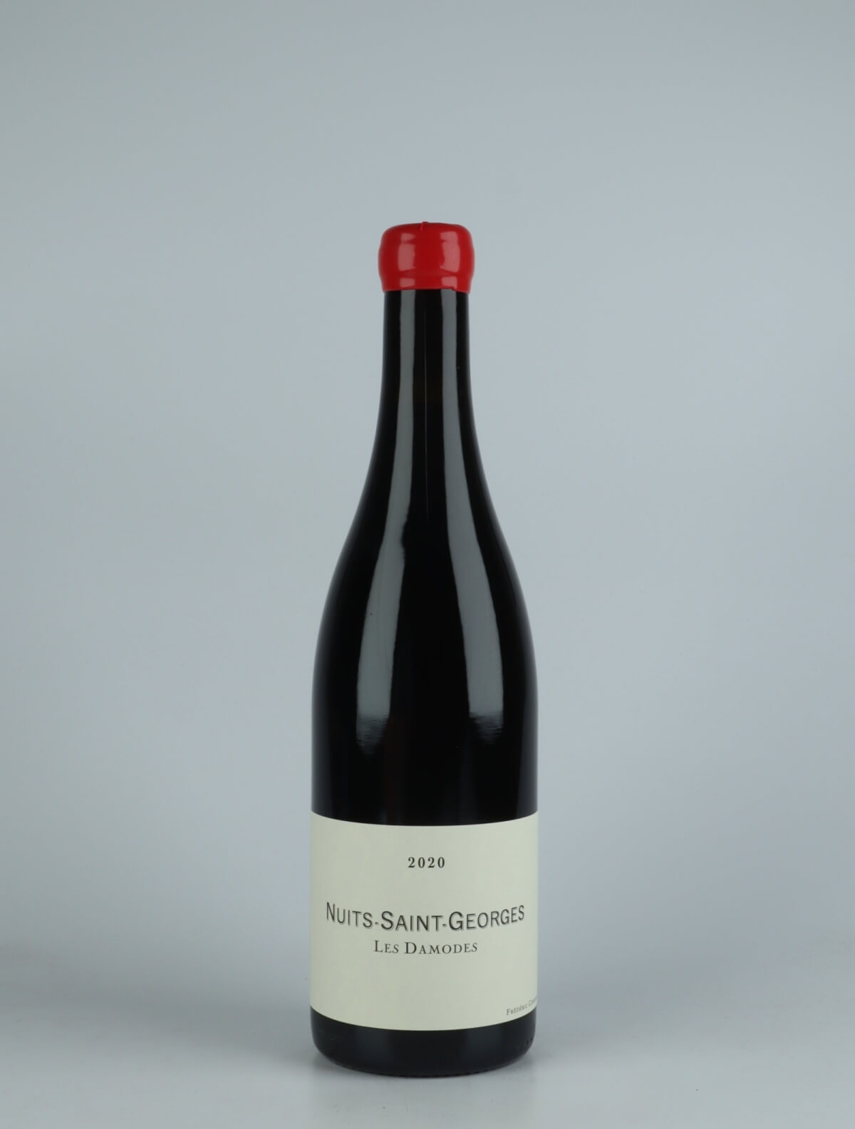 A bottle 2020 Nuits Saint Georges - Damodes Red wine from Frédéric Cossard, Burgundy in France