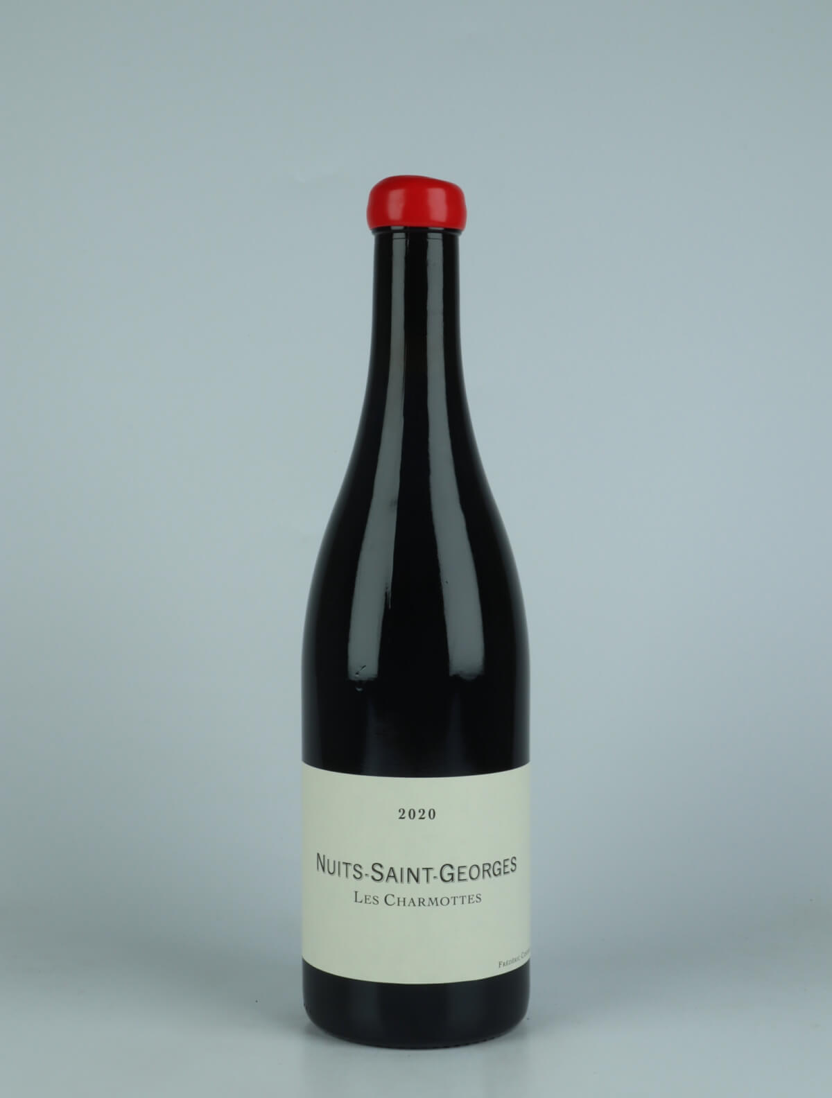 A bottle 2020 Nuits Saint Georges - Les Charmottes Red wine from Frédéric Cossard, Burgundy in France