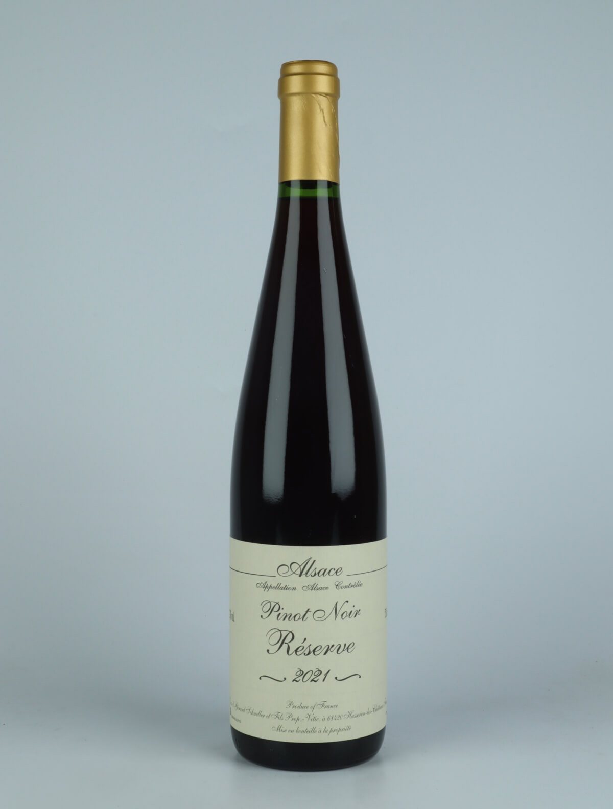 A bottle 2021 Pinot Noir - Réserve Red wine from Gérard Schueller, Alsace in France