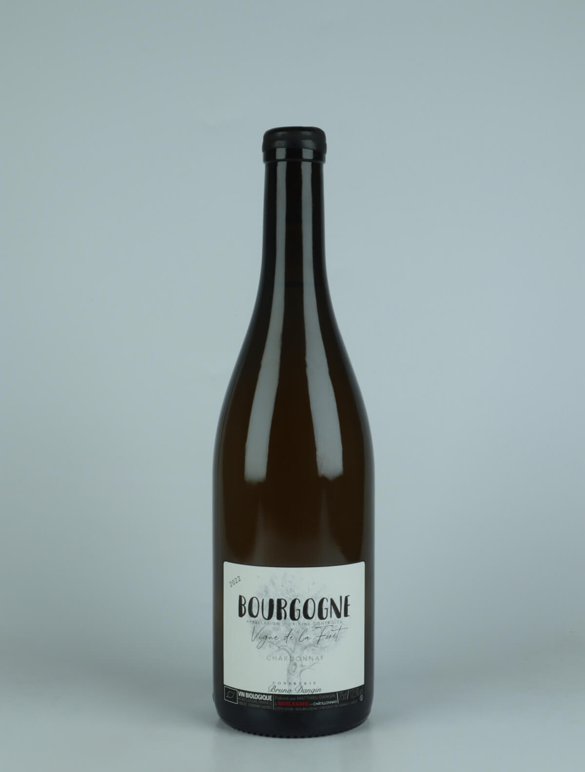 A bottle 2022 Bourgogne Blanc - Vigne de la Forêt White wine from Domaine Bruno Dangin, Burgundy in France