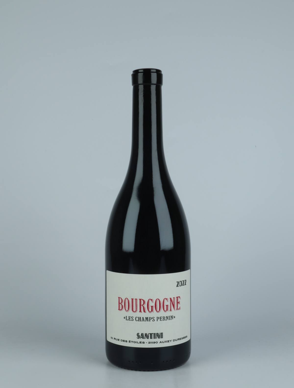 A bottle 2022 Bourgogne Rouge - Les Champs Pernin Red wine from Santini, Burgundy in France
