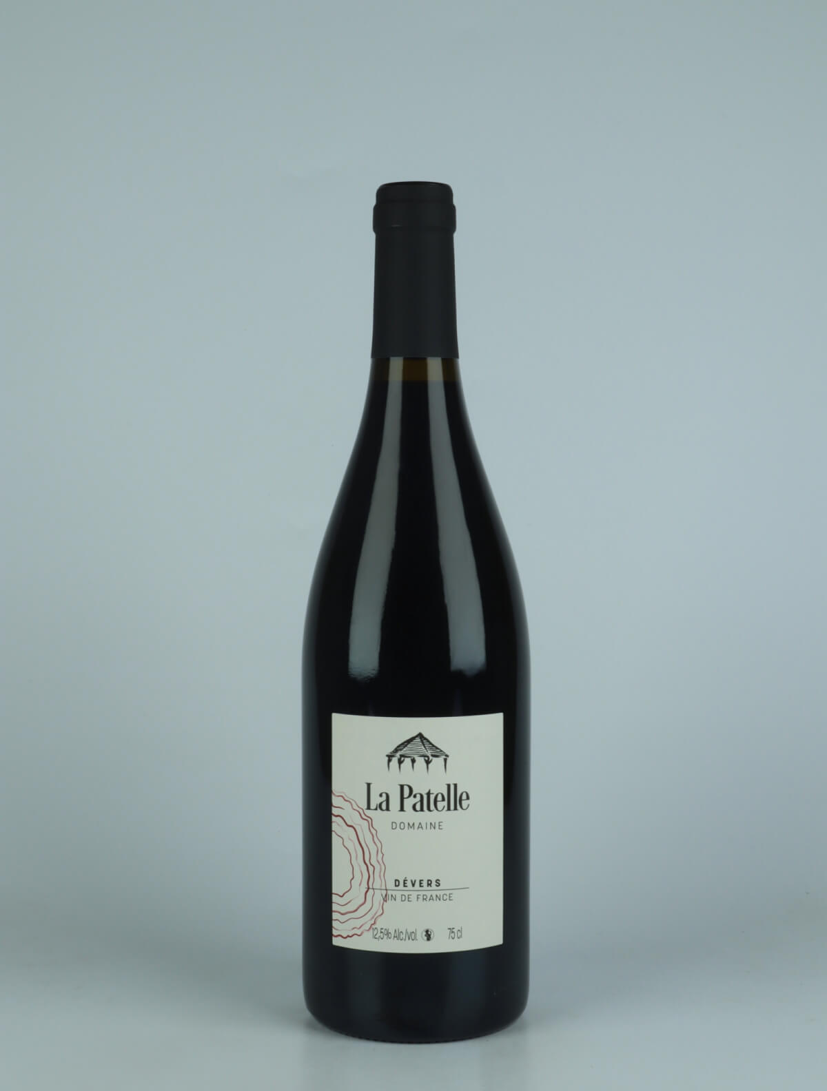 A bottle 2022 Dévers - Pinot Noir Red wine from Domaine de La Patelle, Jura in France