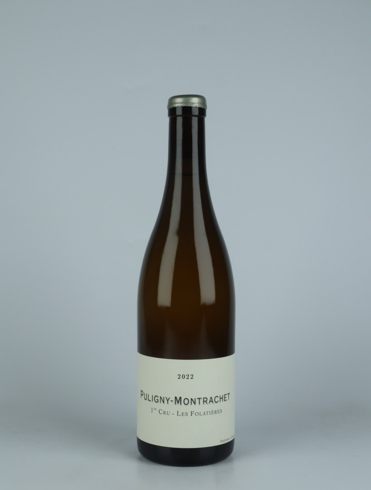 A bottle 2022 Puligny Montrachet 1. Cru - Folatières White wine from Frédéric Cossard, Burgundy in France