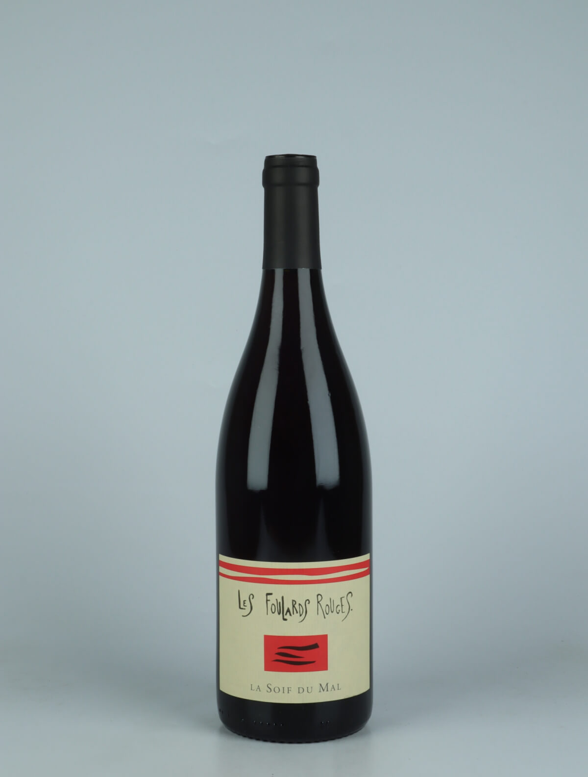 A bottle 2023 Soif du Mal Rouge Red wine from Les Foulards Rouges, Languedoc in France