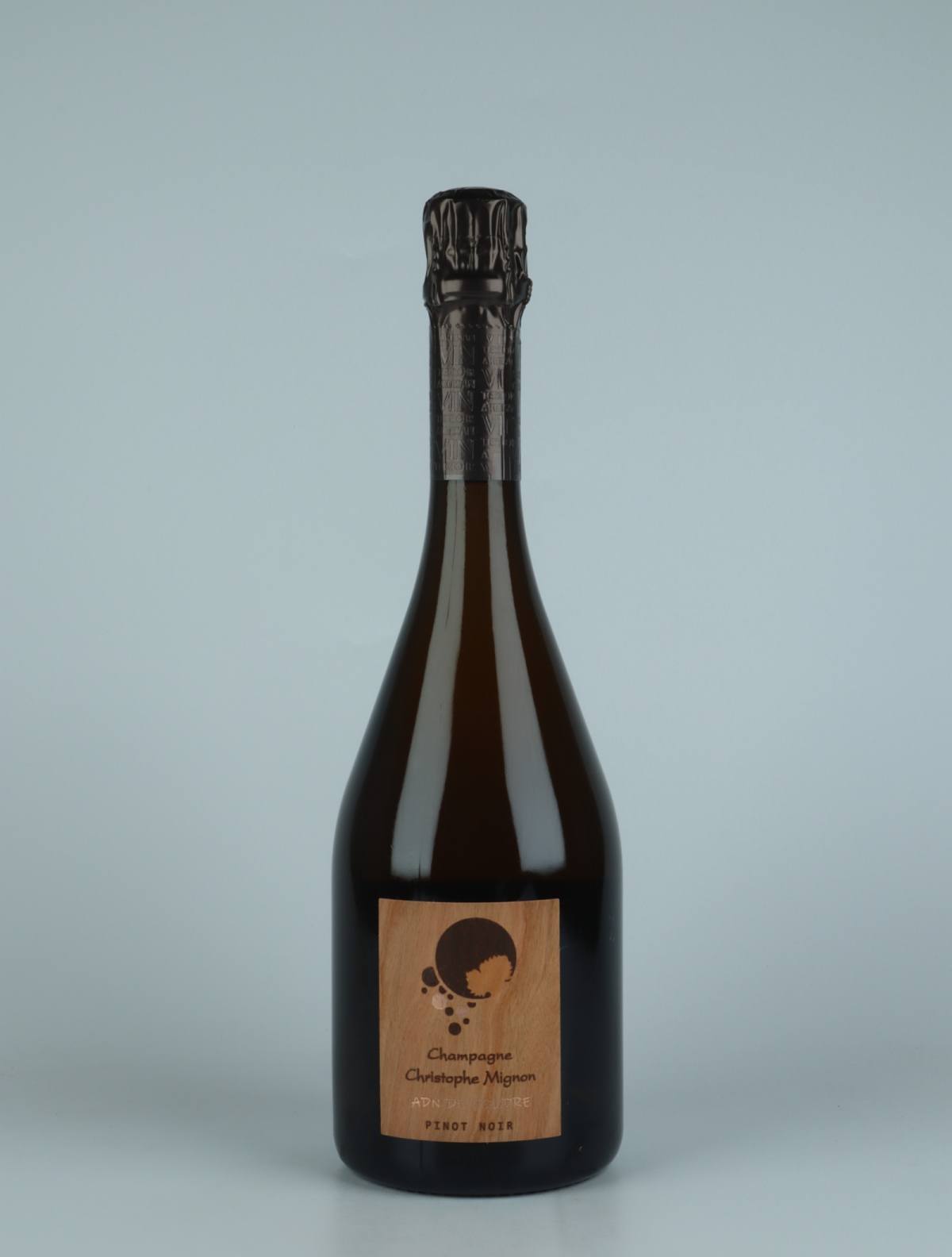 A bottle 2016 ADN de Foudre Pinot Noir Brut Nature Sparkling from Christophe Mignon, Champagne in France