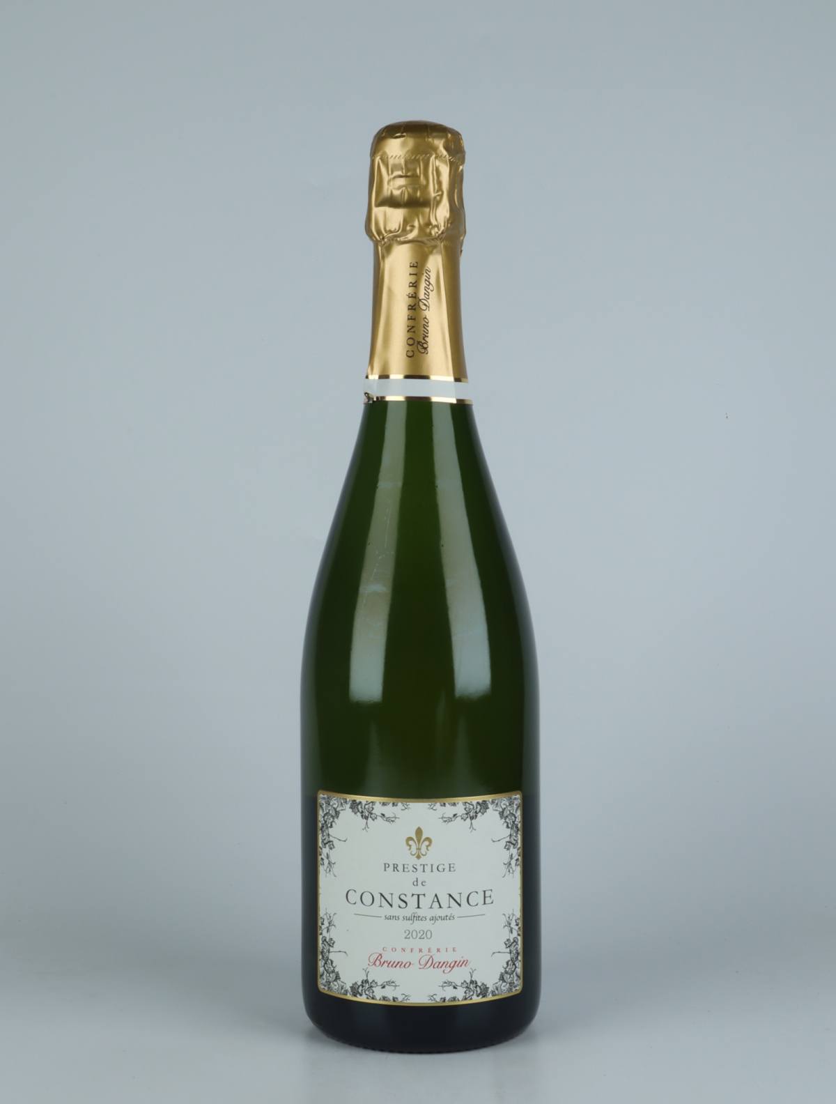 A bottle N.V. Crémant Extra Brut - Prestige de Constance Sparkling from Domaine Bruno Dangin, Burgundy in France