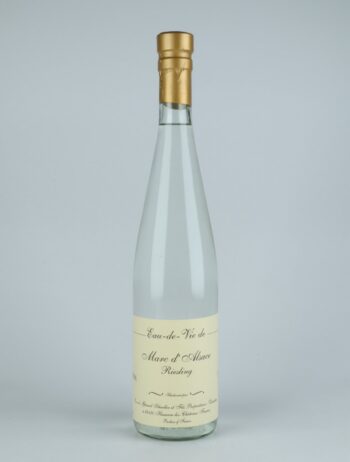 A bottle N.V. Eau de Vie de Marc de Riesling Spirits from Gérard Schueller, Alsace in France