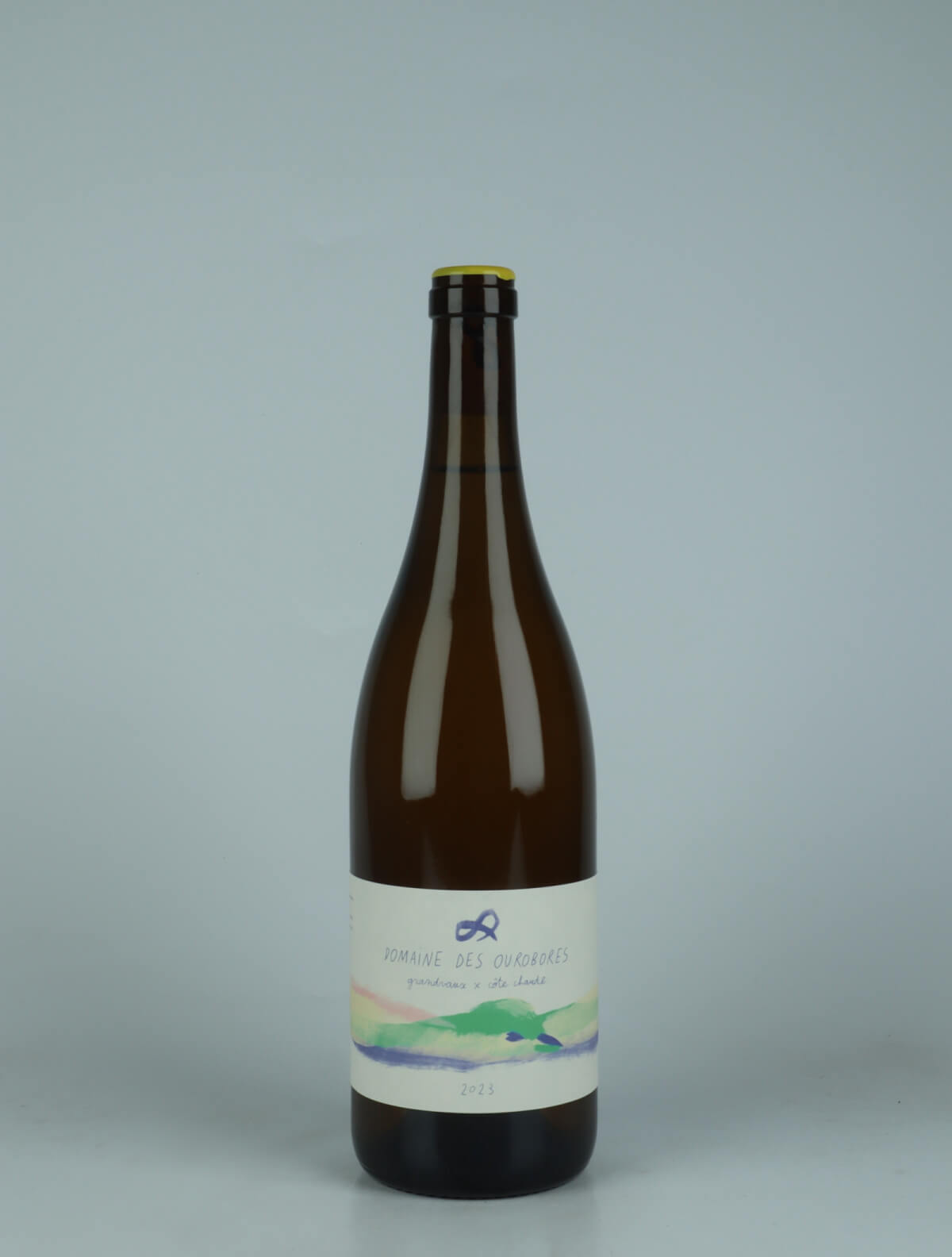 A bottle 2023 Grandvaux x Côte Chaude - Savagnin, Chardonnay Hvidvin from Domaine des Ourobores, Jura in Frankrig