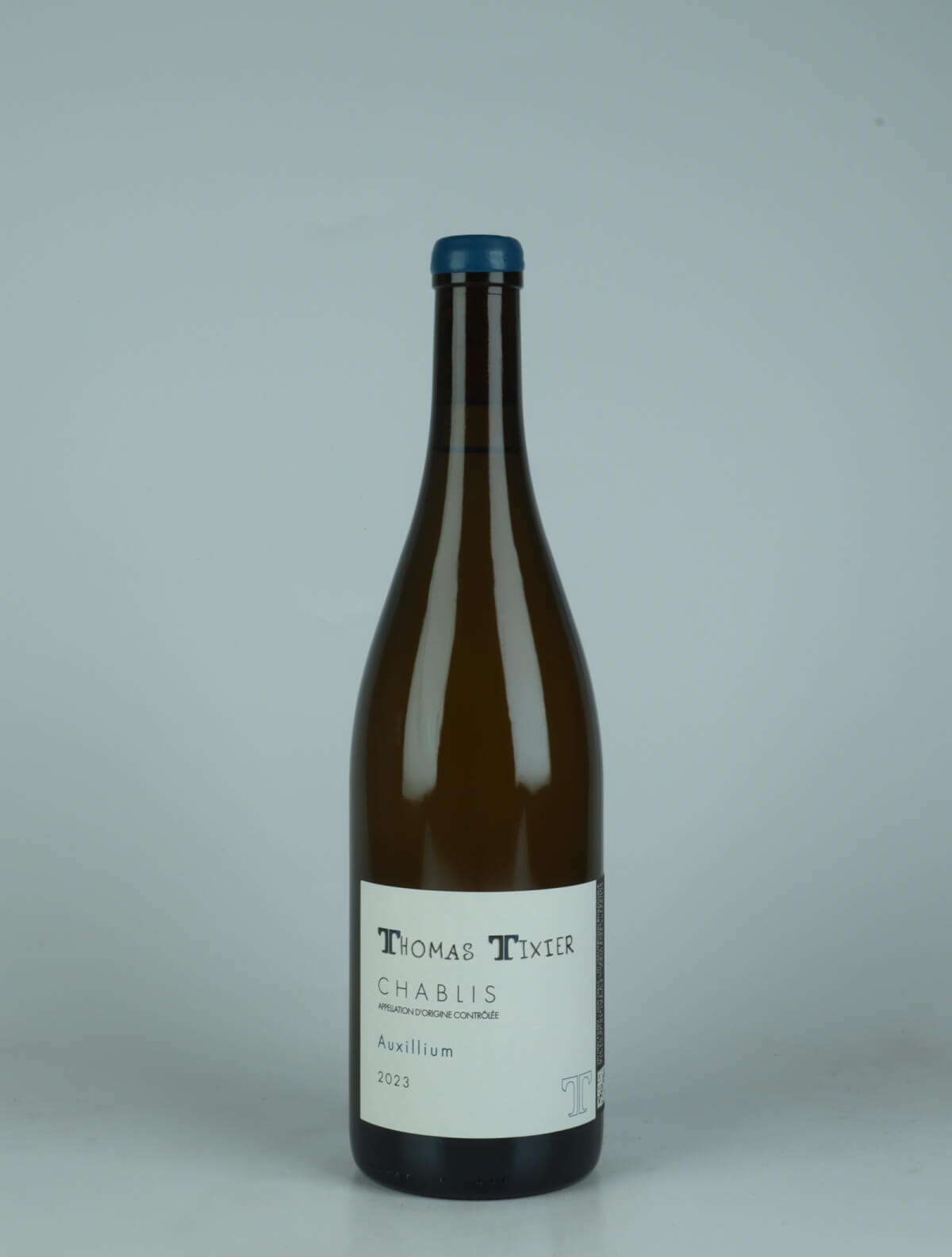 A bottle 2023 Chablis - Auxillium White wine from Thomas Tixier, Burgundy in France