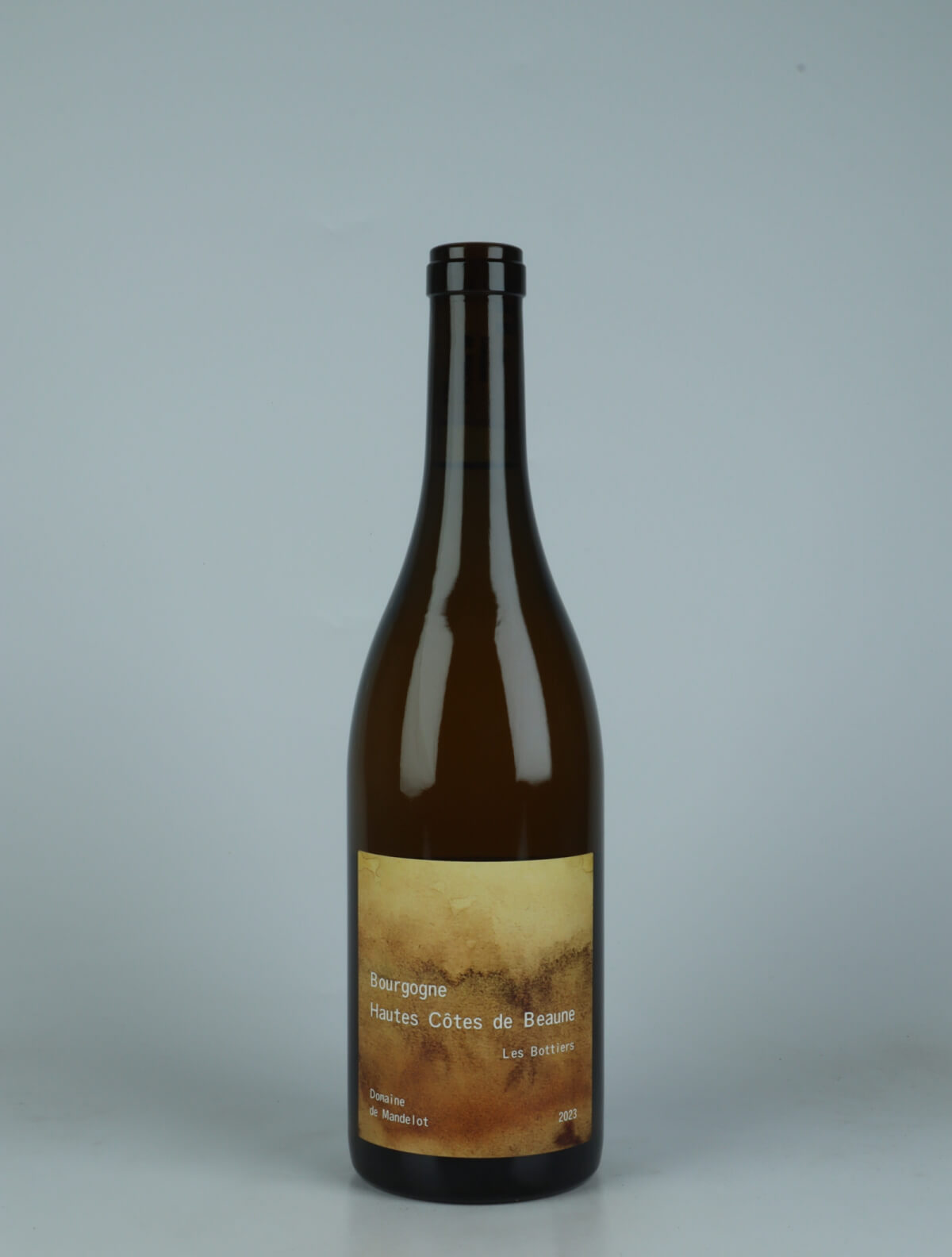 A bottle 2023 Hautes-Côtes de Beaune Blanc - Macération - Les Bottiers Orange wine from Domaine de Mandelot, Burgundy in France