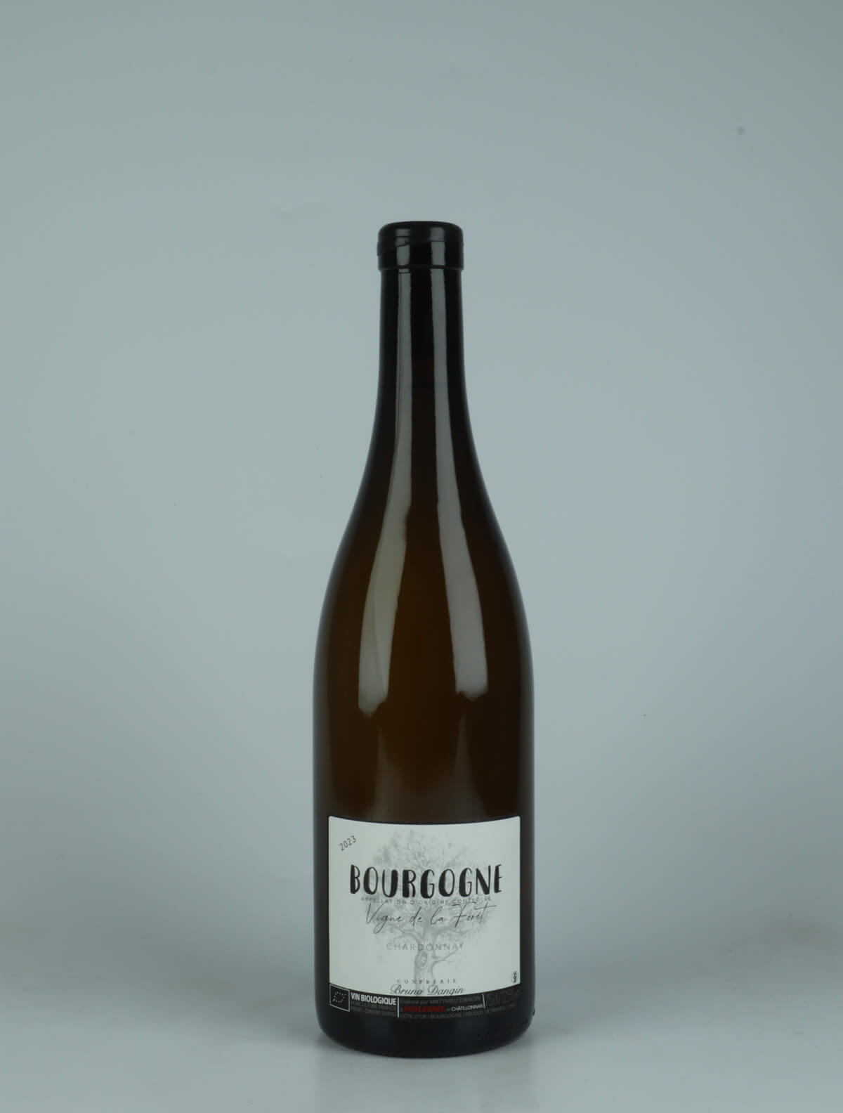A bottle 2023 Bourgogne Blanc - Vigne de la Forêt Hvidvin from Domaine Bruno Dangin, Bourgogne in Frankrig